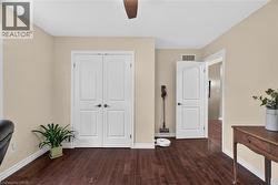 Rich wood-finish flooring with white trim - 