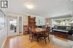 Hardwood flooring, crown molding, double French doors, large picture windows, and recessed lighting - 