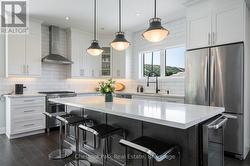 Stone counters - stainless appliances in kitchen - 