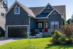 A welcoming front entrance & perennial gardens - 