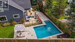 Walkout to deck, hot tub patio and inground pool - 