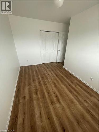 Main bedroom with wood-type flooring - 124 Avalon Place, Kitchener, ON 