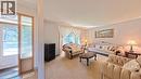 Carpeted living area with a large window - 56 Scenic Wood Crescent, Kitchener, ON 
