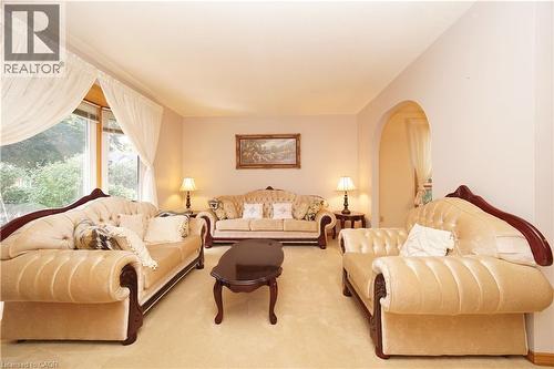 Arched doorway, wall-to-wall carpeting, and large picture window - 56 Scenic Wood Crescent, Kitchener, ON 