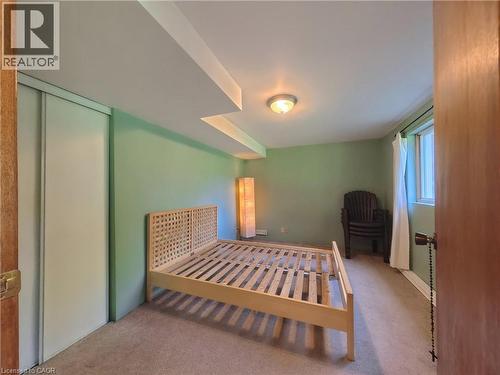 Recessed ceiling features, light green painted walls, and a window with white curtains - 56 Scenic Wood Crescent, Kitchener, ON 