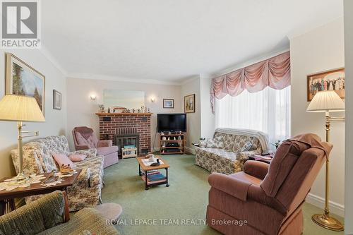 Living Room w/ Wood-Burning Fireplace - 84 Rita Avenue, Ottawa, ON 