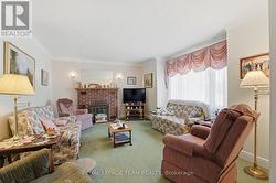 Living Room w/ Wood-Burning Fireplace - 