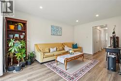 Recessed lighting illuminates wood-finish flooring - 