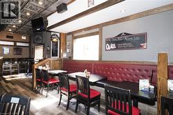 Wood-finish flooring throughout, complemented by exposed wood beams - 
