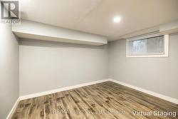 2nd Bsmt Bedroom with Stored Items Removed via AI - 