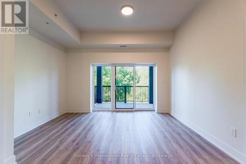 Spacious living room with sliding doors to Balcony - 316 - 121 Mary Street, Clearview (Creemore), ON 