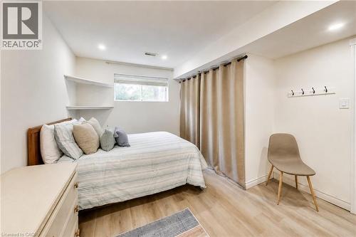 Recessed lighting, wood-finish flooring, built-in wall shelves, and a window for natural light - 35 Shirlea Boulevard, Keswick, ON 