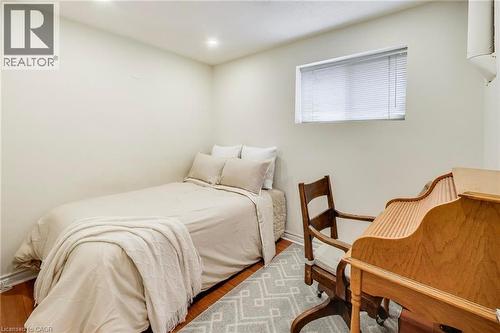 Recessed lighting, wood-finish flooring, and a single window with blinds - 35 Shirlea Boulevard, Keswick, ON 