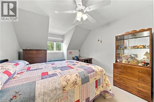 Sloped ceilings, window with roller shade, and ceiling fan with light fixture - 31 Book Road Unit# 44, Grimsby, ON 