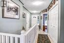 Foyer featuring tile flooring, white railings, and a white paneled door with a transom window - 150 Oak Street Unit# 27, Simcoe, ON 