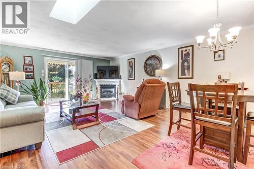 Wood-finish flooring throughout, with a recessed ceiling light and a skylight - 150 Oak Street Unit# 27, Simcoe, ON 