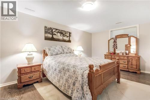Neutral wall paint, wood-finish flooring, and overhead lighting - 150 Oak Street Unit# 27, Simcoe, ON 