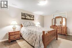 Neutral wall paint, wood-finish flooring, and overhead lighting - 