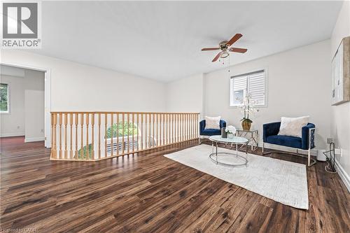 Wood-finish flooring, white walls, and a ceiling fan - 495 Brigantine Drive, Waterloo, ON 