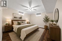 Recessed window, wood-finish flooring, ceiling fan, wood bed frame, wood nightstands - 