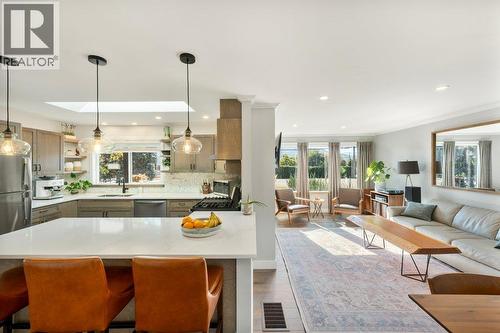 Kitchen with quartz counters and counter seating - 886 Fairview Road, Oliver, BC 