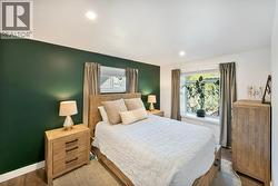 Primary bedroom with beautiful view window to back yard - 