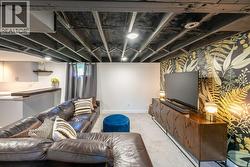 Basement family or media room with wet bar - 