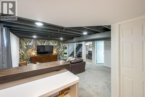 Basement family or media room with wet bar/kitchenette - 886 Fairview Road, Oliver, BC 