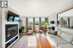 Living room with gas fireplace & crown molding - 
