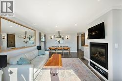 Living room with gas fireplace & crown molding - 