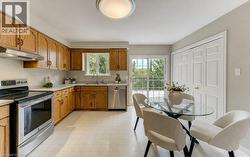 Main floor kitchen. Bi-fold doors open to laundry area (currently used as a pantry but hook-ups are there) - 