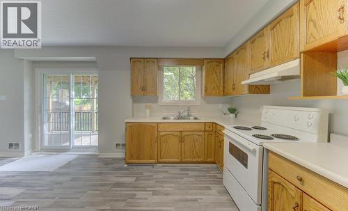 Lower level (walkout basement). Sliding doors to covered composite deck. - 26 Stanmore Avenue, Kitchener, ON 
