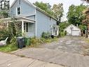 side of the Home - driveway and garage - 128 Kent Street S, Simcoe, ON 