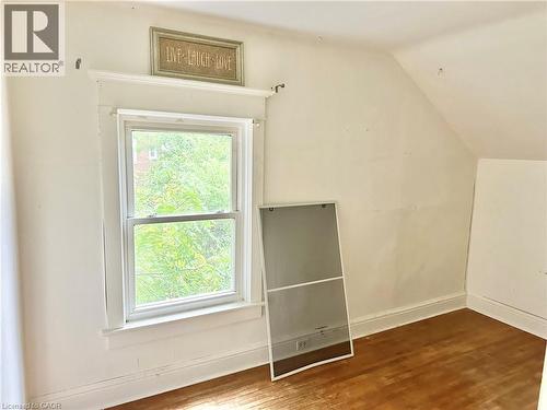 Bedroom - painted walls, white trim, and a window with natural light - 128 Kent Street S, Simcoe, ON 