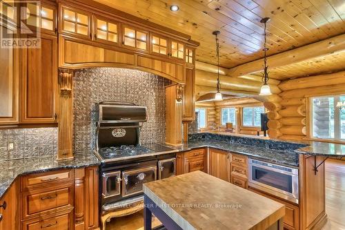 Select-cherry cabinetry &  modern Elmira cookstove - 2467 Darling Road, Lanark Highlands, ON 