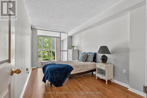 Bedroom 2 with access to Sunroom - 204 - 162 Martindale Road, St. Catharines (Grapeview), ON 