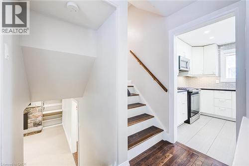 Staircase featuring wood treads and a wood handrail - 2037 Mountain Grove Avenue, Burlington, ON 