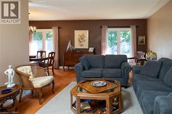 Hardwood-style flooring throughout, with a recessed wall separating spaces - 