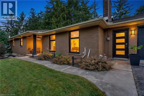 Brick exterior featuring a covered porch with recessed lighting - 7 Shadywood Lane, Cambridge, ON 