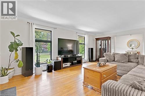 Hardwood flooring throughout, crown molding, and abundant natural light from multiple windows - 7 Shadywood Lane, Cambridge, ON 