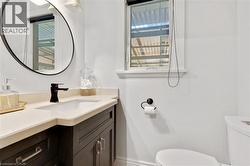 Dark wood-finish vanity with an integrated sink and light-toned countertop - 