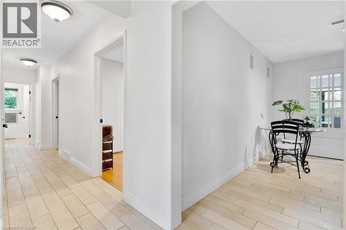 Light-toned flooring throughout, white walls, and recessed lighting fixtures - 7 Shadywood Lane, Cambridge, ON 