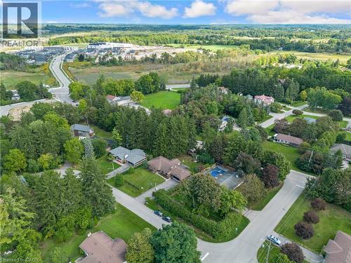 Residential property featuring mature tree landscaping, an inground swimming pool, and a tennis court - 7 Shadywood Lane, Cambridge, ON 