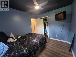Wood-finish flooring with white trim - 