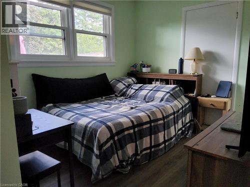 Wood-finish flooring with light green wall tones - 33 Lee Avenue, Simcoe, ON 