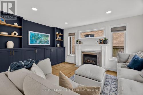 Living room custom built-ins + gas fireplace - 121 Tanoak Drive, London North (North E), ON 