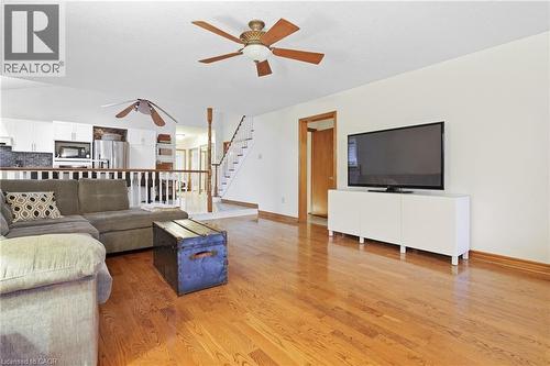 Hardwood flooring, white walls, and a ceiling fan with integrated lighting - 76 Madeira Crescent, Cambridge, ON 