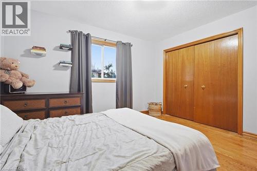 Wood-finish flooring with light-toned walls - 76 Madeira Crescent, Cambridge, ON 
