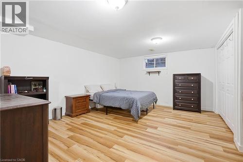 Light-toned wood-finish flooring, recessed window, and flush-mount lighting - 76 Madeira Crescent, Cambridge, ON 
