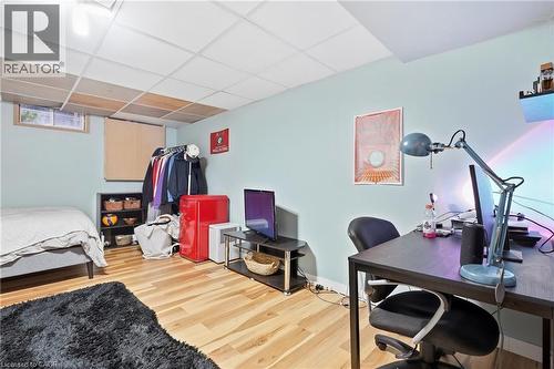 Recessed lighting, wood-finish flooring, drop ceiling, light-toned walls, and a window with natural light - 76 Madeira Crescent, Cambridge, ON 